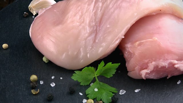 Portion of raw Chicken Fillet as seamless loopable 4K footage