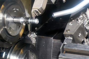 Turning. Cutter CNC lathe to grind the groove on the workpiece

