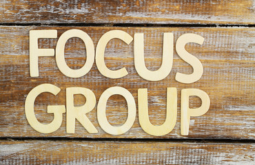 Focus group written with wooden letters on rustic surface