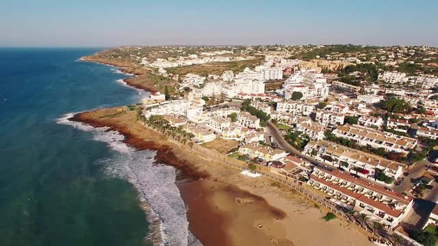 Beach of Praia da Luz at morning, Lagos, Algarve, Portugal aerial view