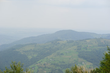 Obraz premium Summer landscape in mountains and the dark blue sky with clouds