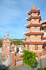 Fototapeta na wymiar Multi-tiered pagoda in the Buddhist temple Chua Buu Son. Neighborhood of the city of Phan Thiet, Vietnam