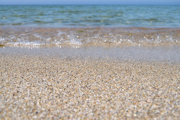 Fototapeta na wymiar blue sky and clear sea near the shelly sand coast, background