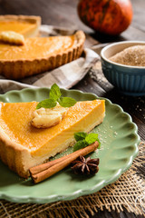 Traditional American pumpkin pie with cinnamon and mint