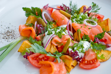 salad with fish and tomato, with greens