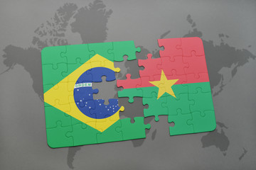 puzzle with the national flag of brazil and burkina faso on a world map background.