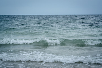 Fototapeta na wymiar Waves in the Atlantic Ocean in Sandwich, Cape Cod, Massachusetts