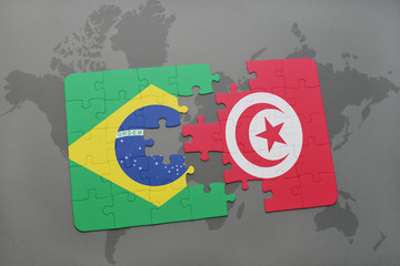 puzzle with the national flag of brazil and tunisia on a world map background.