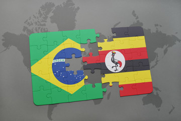 puzzle with the national flag of brazil and uganda on a world map background.