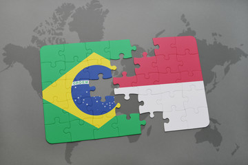 puzzle with the national flag of brazil and indonesia on a world map background.