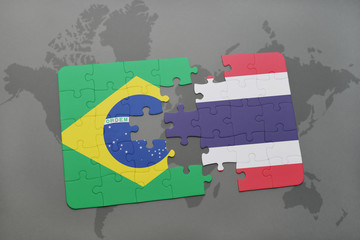 puzzle with the national flag of brazil and thailand on a world map background.