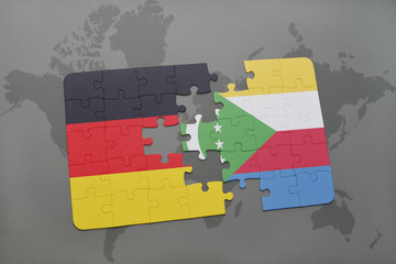 puzzle with the national flag of germany and comoros on a world map background.