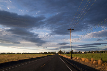 empty road under a dark and stormy sky
