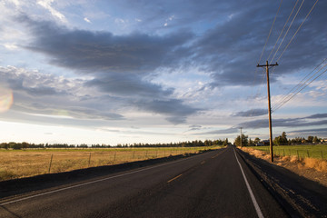 empty road under a dark and stormy sky