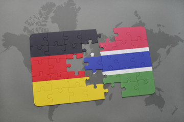 puzzle with the national flag of germany and gambia on a world map background.