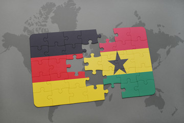 puzzle with the national flag of germany and ghana on a world map background.