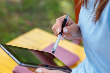 Woman working on digital tablet pc