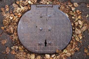hinged cover sewer manhole. old design manhole covers, top view