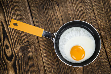 Fried Eggs on wooden background