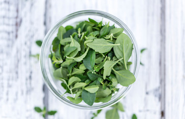 Wooden Table with fresh Menthol leaves