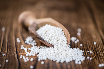 Tapioca on wooden background (selective focus)
