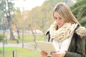 Portrait of a young woman using her tablet.