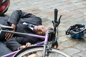 Cyclist Lying On Street After Accident