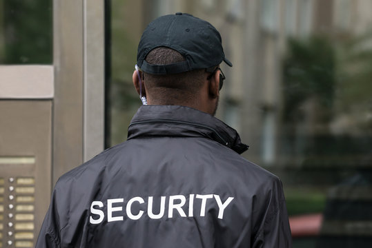 Rear View Of A Security Guard