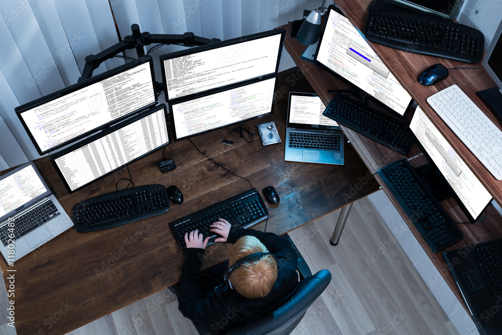 Poster Boy Working On Multiple Computers