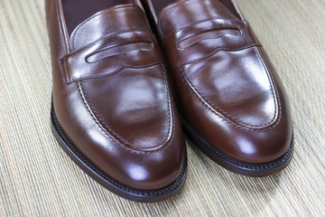 Footwear Concept and Ideas. Men's Stylish Brown Penny Loafers Shoes