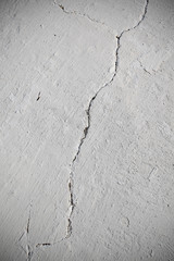Rent in the whitewashed wall © sudok1