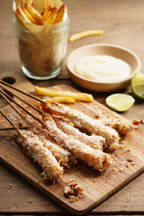 crumbed prawn skewers with potato fries