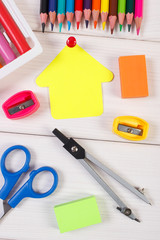 School accessories and shape of building on white boards, back to school concept