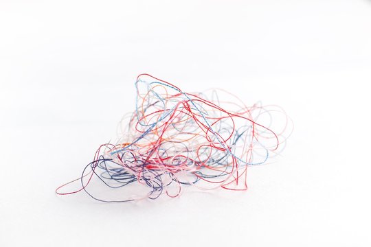 Tangled Colored Thread On A White Background,selective Focus