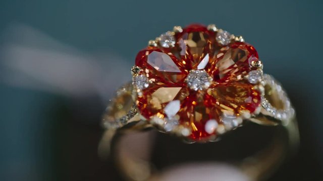 Closeup of beautiful ruby and diamond flower ring in gold