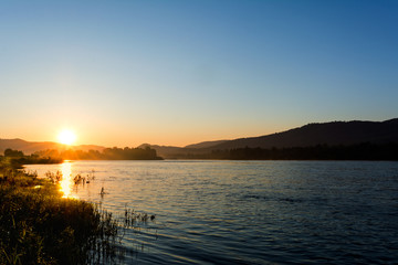 Fototapeta na wymiar Summer sunrise over beautiful river landscape