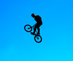 Fototapeta na wymiar Silhouette image of a cyclist on the background of the sky