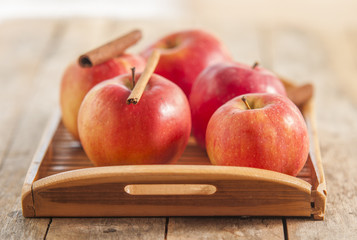 Red winter apples with cinnamon sticks