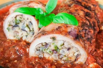 Stuffed squid with parmesan cheese, onion and parsley in tomato sauce.