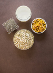 oats in wooden bowl and muesli ingredients