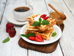 belgian waffles with strawberries and mint