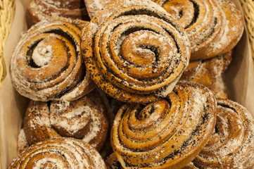 pastries, buns with poppy, sprinkled with powdered sugar