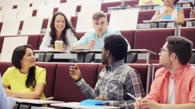 group of students and teacher in lecture hall