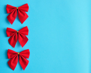 Red bows isolated on a blue background