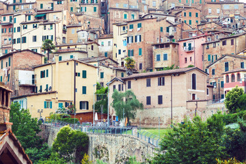 Obraz premium Old residential houses in medieval city of Siena, Italy
