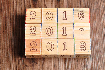2016 2017 2018 written with wooden blocks on wooden