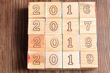 2016 2017 2018 2019 written with wooden blocks on wooden