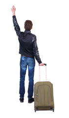Back view of man with  green suitcase man greeting waving from his hands. Rear view people collection.  backside view of person.  Isolated over white background. Tourist holding the handle of a