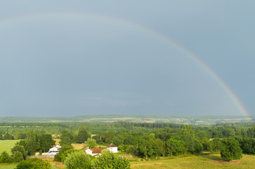 Landscape with a rainbow in France .