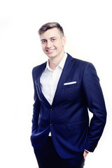 Closeup portrait, young professional, beautiful in blue shirt, arms crossed folded, smiling isolated indoors office background. Positive human emotions